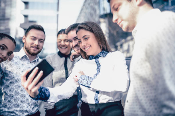 Business Team Making Video Call With Their Colleague Who Is On Vacation